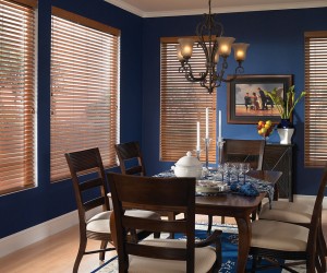 Dining room with dark blue walls and light wooden blinds