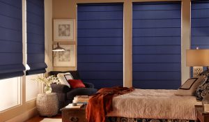 Dark blue Roman shades in a bedroom