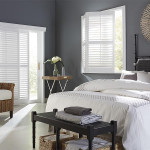 A beautiful pictures of a big luxury home with the window shutters