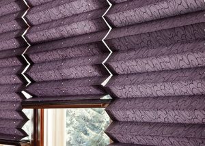 close up of pleated shades on a window