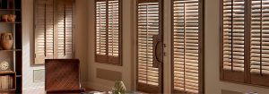 A picture of a beautiful big room with interior window shutters