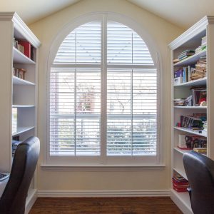 Shutters in beige office room with bookshelves